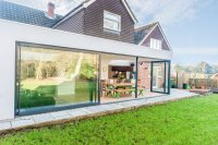 Modern garden extension in Hove featuring large glass doors and clean architectural lines, showcasing DWG Plans Sussex’s residential design expertise.